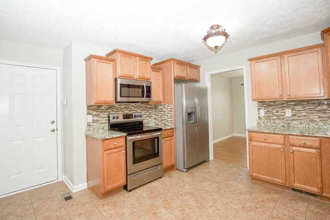 Building Photo - "Charming 4-Bedroom Home with Granite Coun...