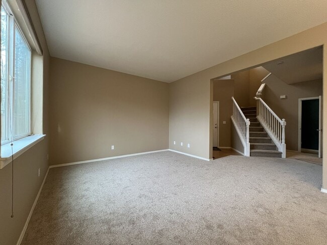Building Photo - Inviting Two-Story 3BR Home Featuring New Carpet, New Stainless Appliances, Spacious Garage Stora...