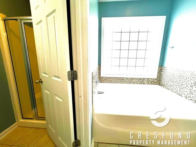 Building Photo - Freshly Painted and Spacious 4 Bedroom, 3 ...