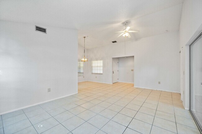 Building Photo - Beautiful Must See!! 3/2 Plus Sunroom & Garage!!  Gated Community!!