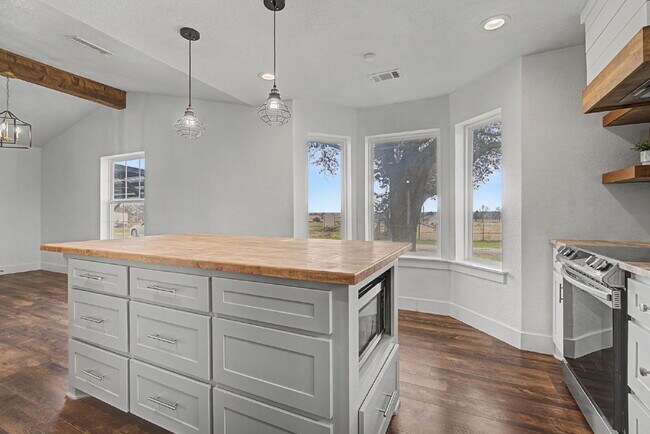 Building Photo - “Farmhouse Charm Meets Modern Luxury on a Serene 5-Acre Lot!”