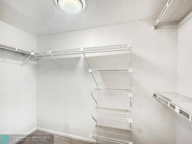 Building Photo - 6090 N Sabal Palm Blvd