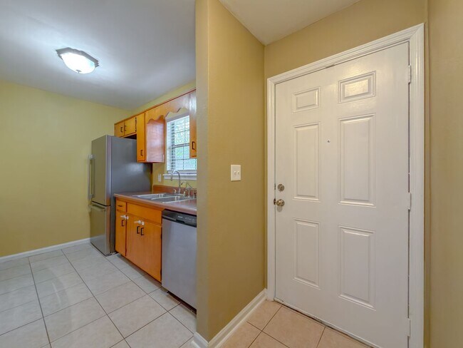 Building Photo - LOVELY & Modern NW 2/1 w/ New Flooring & Huge Privacy Fenced Yard that Inc Lawn Maintenance! Avai...