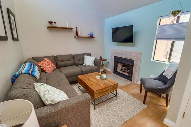 Building Photo - Stunning 2 bed 2 bath top floor condo in gated community with 2 covered parking spaces!