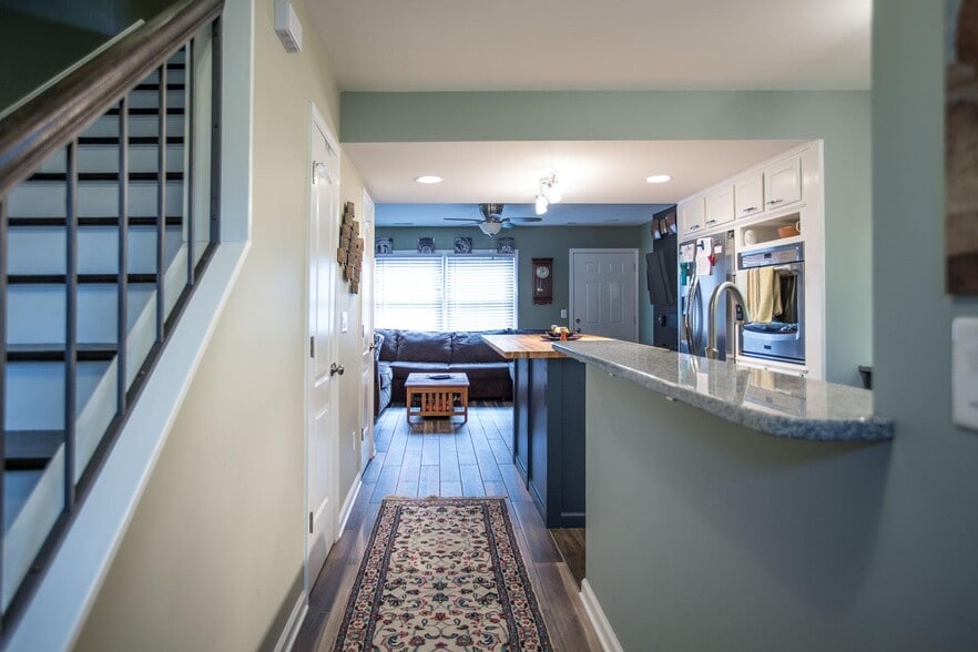 Entry with open floor plan looking into kitchen and living room - 3000 Golden Rd