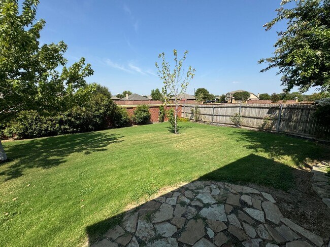 Building Photo - Argyle ISD Gem with Huge Private Backyard & Open Floorplan