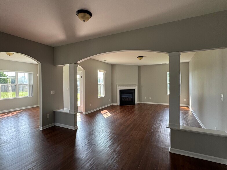 sunroom/sitting area & living room - 100 Pine Lakes Drive
