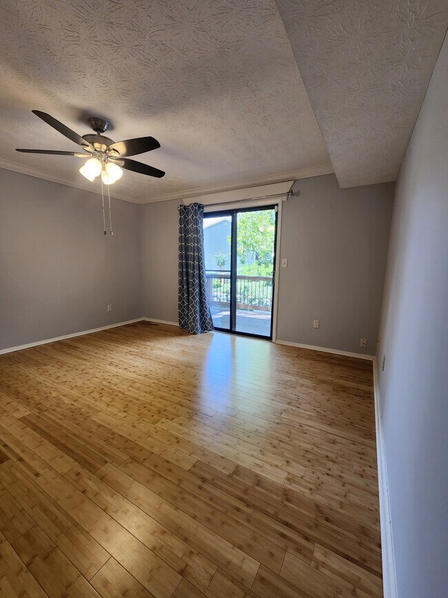 Bedroom full size windows leading to balcony - 514 Park Ridge Cir