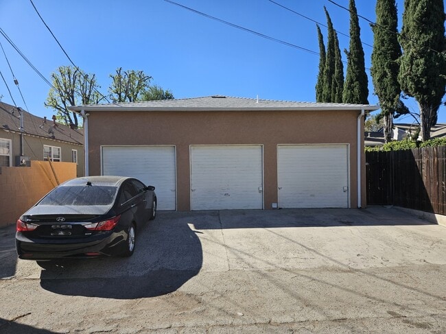 Garages in back alley - 5058 Colfax Ave