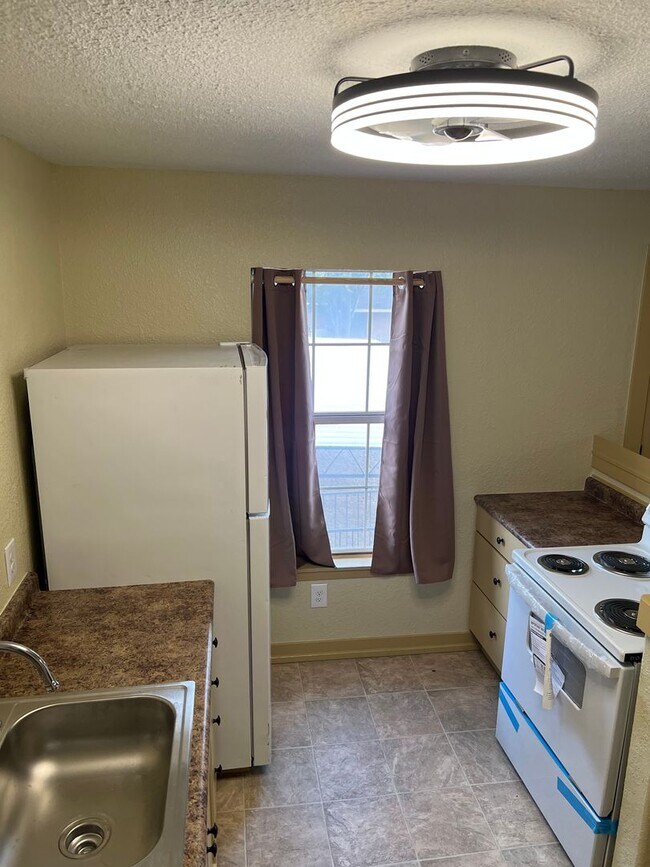 Building Photo - Remodeled Suburban Apartment