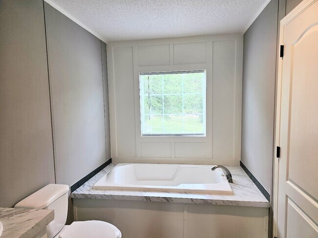 Building Photo - Welcome Home! Spacious 3-Bed, 2-Bath Split Floor Plan on ¾ Acre Lot