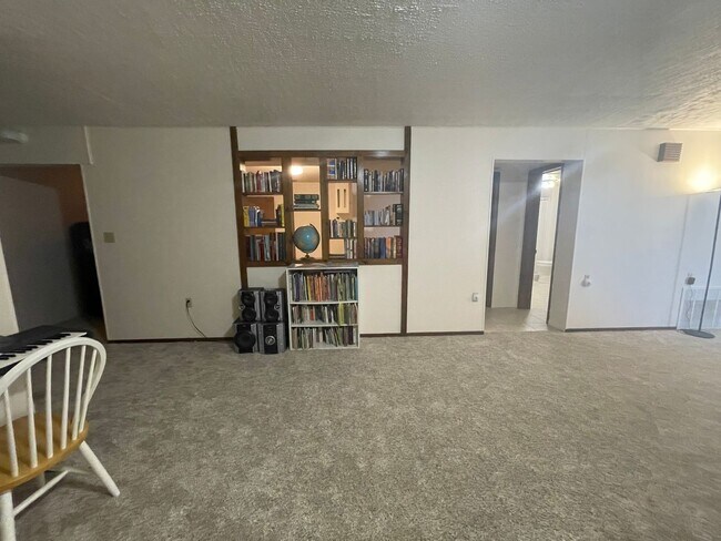 Building Photo - Spacious, four-bedroom, two-bathroom, coun...