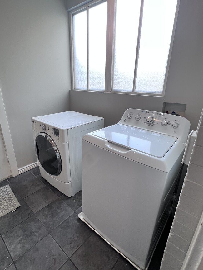 Washer and dryer included in laundry room with storage - 4301 Tejon St