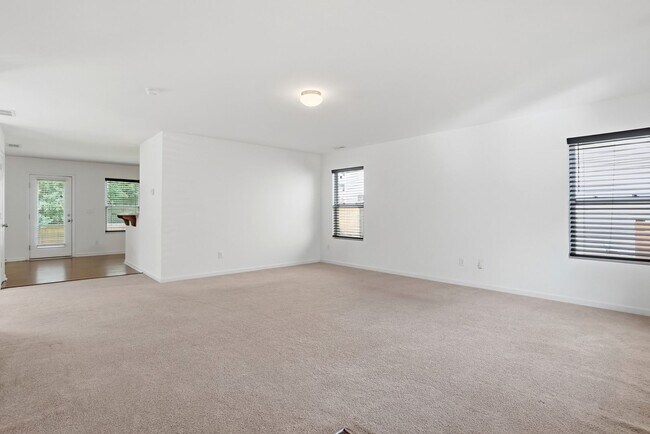 Building Photo - Spacious 4BR Home with New Carpet & Fenced Backyard
