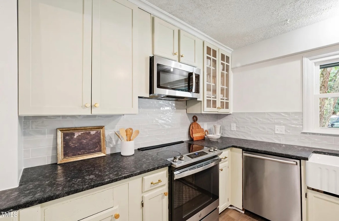 Rand new backsplash, black granite counters, and deep sink. - 115 Inverness Ct