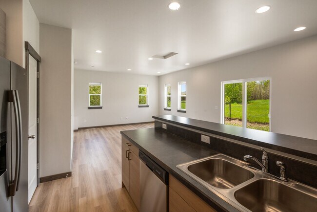 Building Photo - Pet Friendly! Gorgeous 3 Bedroom condo with double stall attached garages with AC.