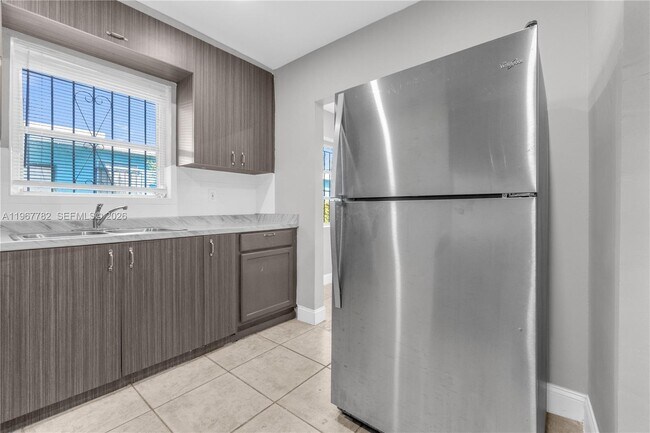 Building Photo - 6940 NW 6th Ct