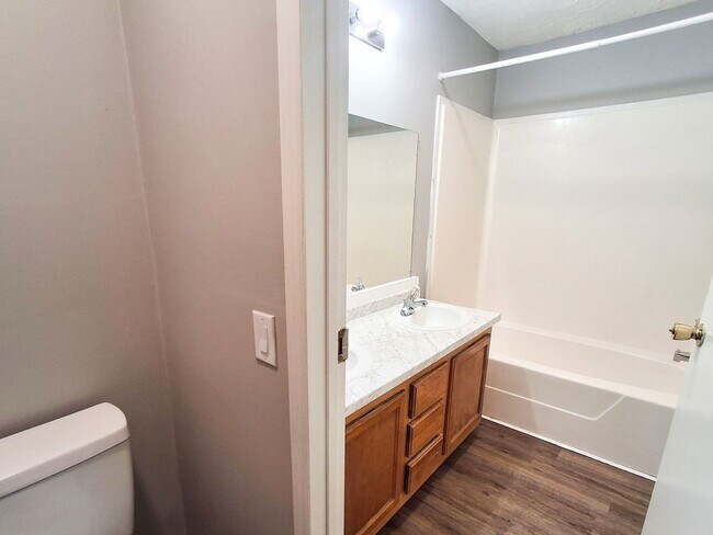 Building Photo - 4 Bed / 2 Full Bath House on a Quiet Dead-End Street — Attached Garage, Central A/C, W/D Hookups ...
