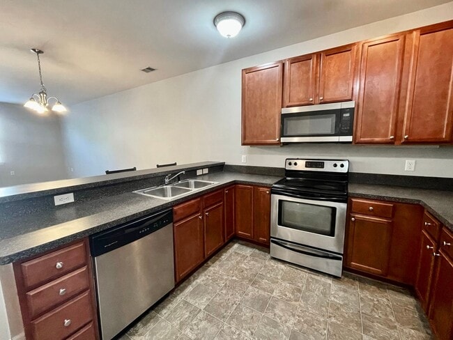 Building Photo - 2 Bedroom Condo w/Open Floor-Plan & Stainless Steel Appliances! Some Utilities Included!