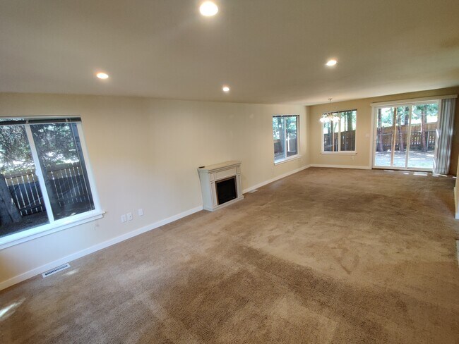 Spacious and lighted Living and Dining Area with fireplace - 17729 NE 88th Pl