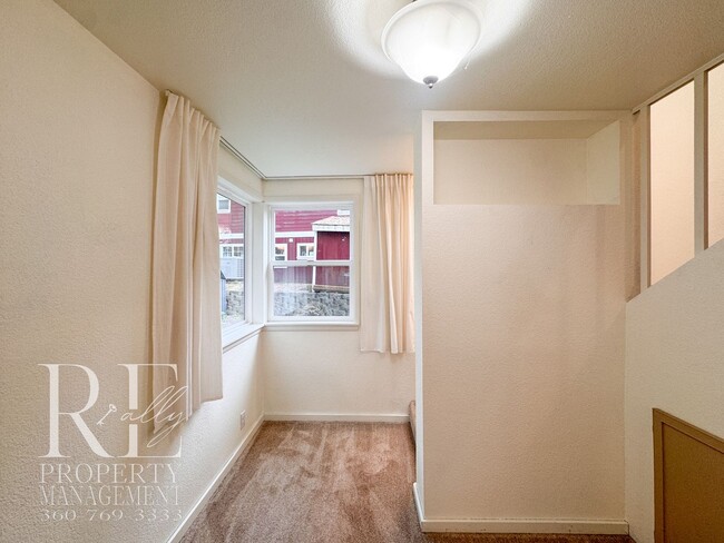 Building Photo - Private Retreat with Expansive Yard & Loft Space