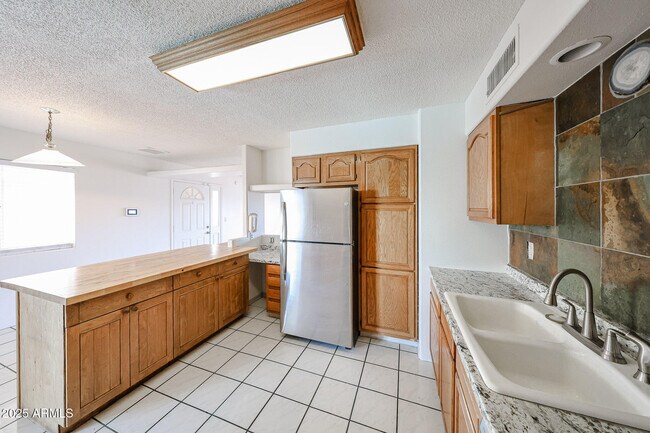 Building Photo - 3408 W Port Au Prince Ln