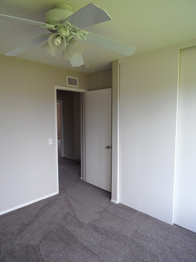 Building Photo - Two Story 4 BR 2.5 BA Condo With 2 Car Garage