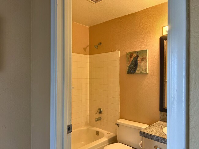Building Photo - LARGE REMODELED 4BR 2BA HOUSE WITH GARAGE, GRANITE COUNTERS, BUILT-IN BREAKFAST BAR, TILE FLOORS