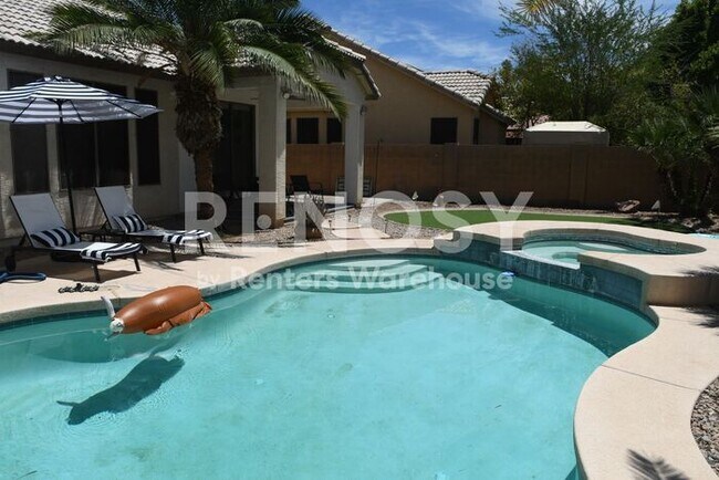 Building Photo - 3 Bedroom + Den Home with Pool & Putting Green – Pool Service Included!