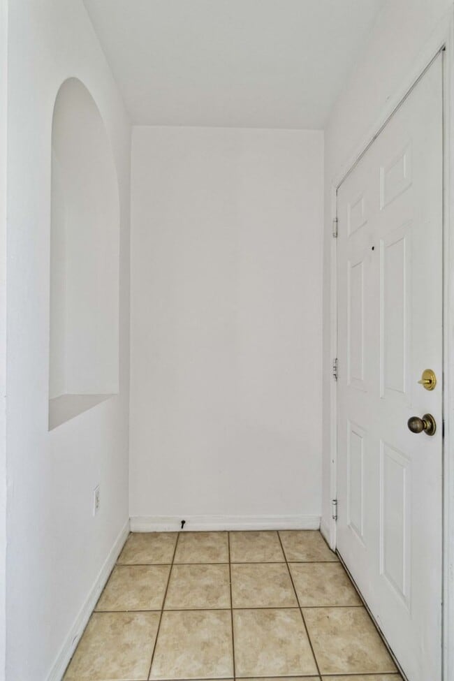 Building Photo - Spacious 1-Bedroom Condo for Annual Rent available now in gated Villagio Community