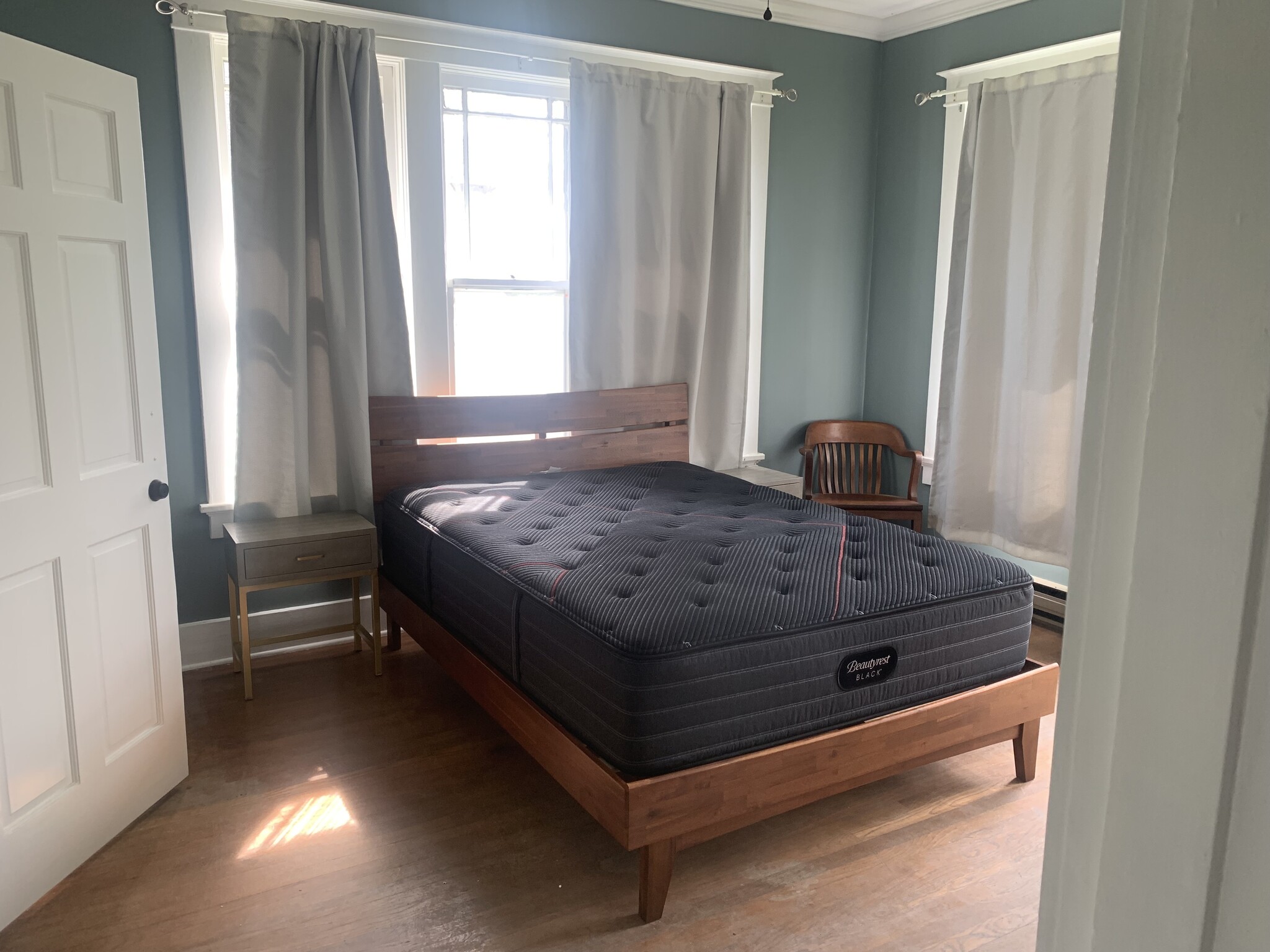 queen bed (has mattress protector), 2 night stands and wooden chair - 1939 Nelson Ave