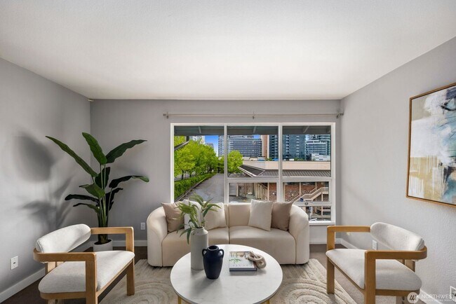Building Photo - Bright Renovated 1 Bedroom Corner Condo in the Heart of Downtown Bellevue