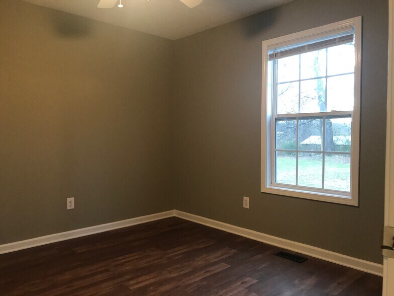 Bedroom 2 freshly painted and new flooring. - 216 Winters St