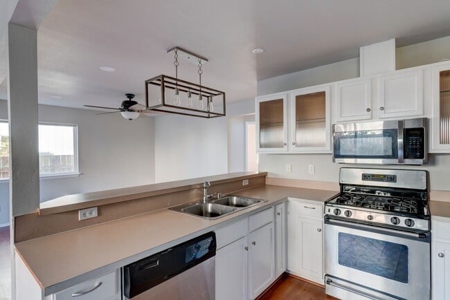 Building Photo - Spacious 4-Bedroom Home with Cozy Backyard...