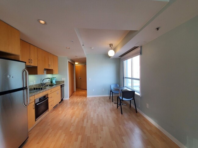 Building Photo - Downtown High-Rise Studio with parking and in-home laundry