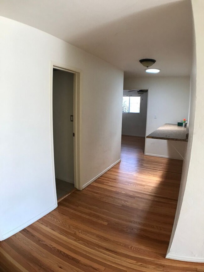 Building Photo - BEAUTIFUL WOOD FLOORS IN THIS- 5 BED 2 BATHROOM- Includes maid service