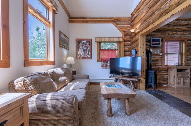 Building Photo - Charming Log Cabin and Carriage House – Do...
