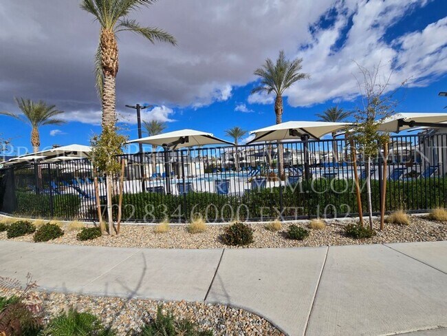 Building Photo - Gated~ 2 Bedroom Townhome w/2 Car Garage~MUST SEE!