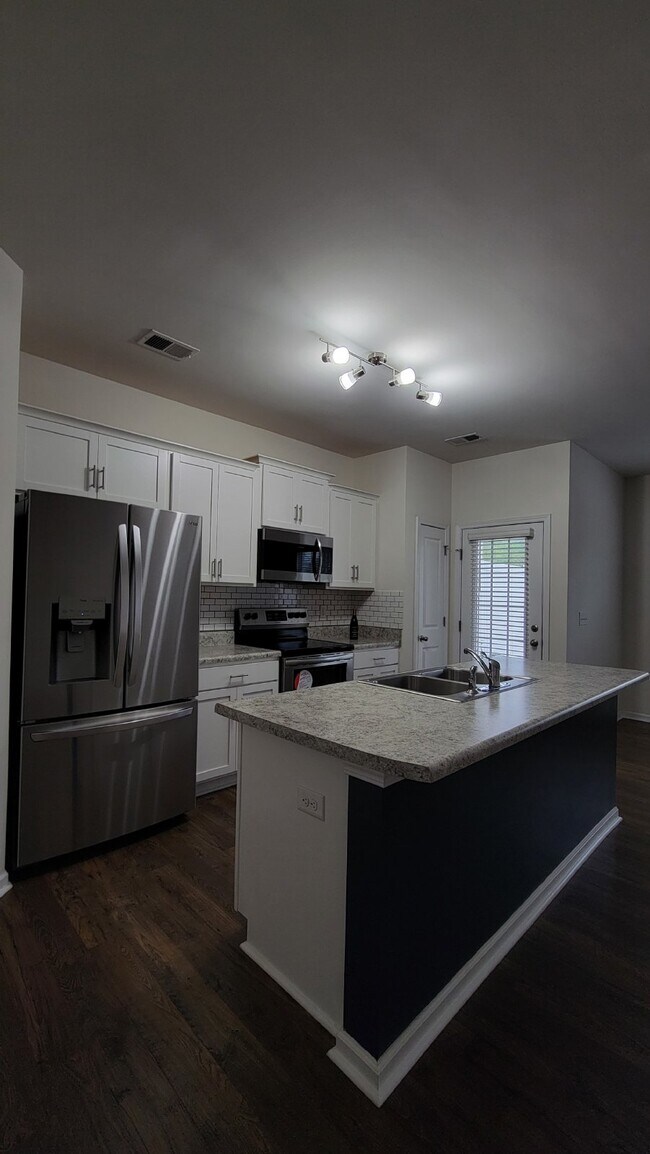 Building Photo - "Modern 3-Bedroom Multiplex with 3 Full Ba...