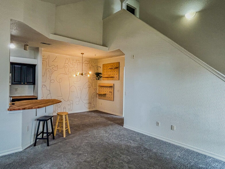 Living room looking into dining area and kitchen - 5378 Palomino Ranch Pt