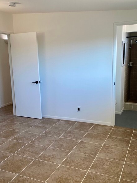 Primary Bedroom with Private Exterior Access & Ensuite Bath - 6393 Desert Queen Ave