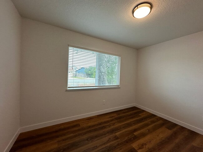 Building Photo - Updated Home with Island Kitchen, LVP Flooring, and Yard Care Included!