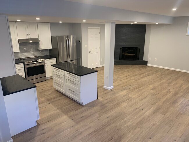 Main kitchen area with fireplace - 4631 Massachusetts Ave NW