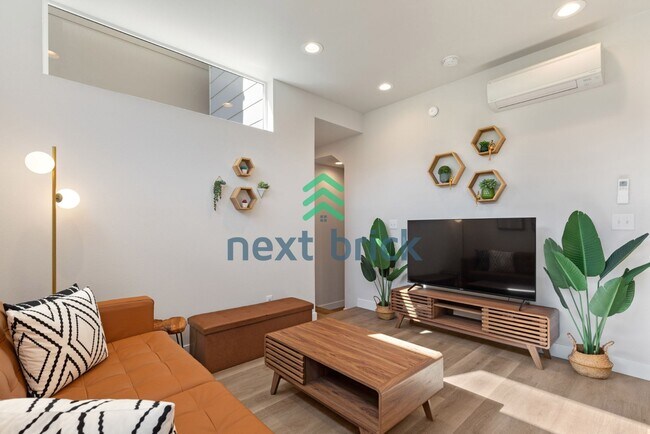 Building Photo - Offer: Unfurnished option available at $3,250, with an optional furnished package for an addition...