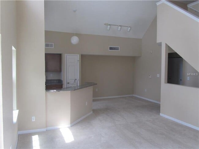 Building Photo - Water view condo with garage in sought after westchase