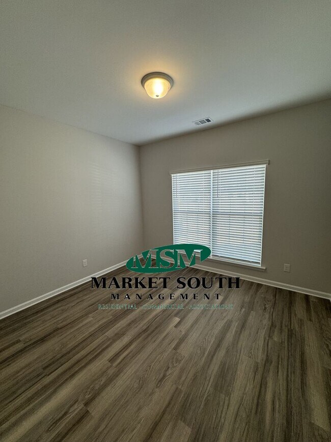 Building Photo - NEW CONSTRUCTION WITH PRIVACY FENCED YARD