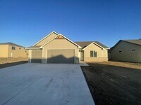 Building Photo - Single family slab home with three car garage. This home is 4 bedrooms, three bathrooms open floo...