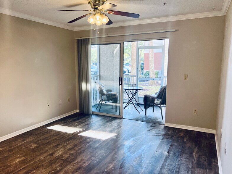Living room with Screen patio view - 1929 Summer Club Dr