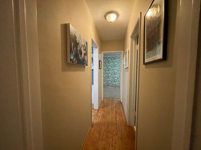 Hallway facing Master BR; bathroom on right, breakfast nook (currently used reception) on left - 1240 Greenacre Ave