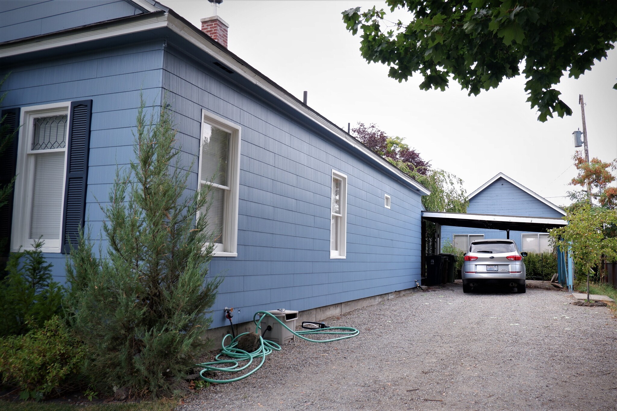 Room for three vehicles in this oversized, off-street driveway! - 3517 E 32nd Ave